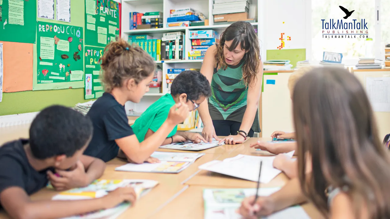 A teacher helping children with schoolwork at a classroom table