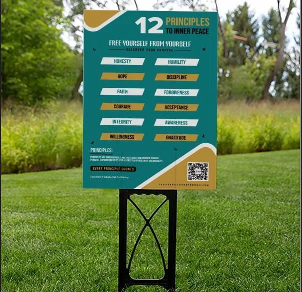 A 12 Principles to Inner Peace yard sign standing on a lawn