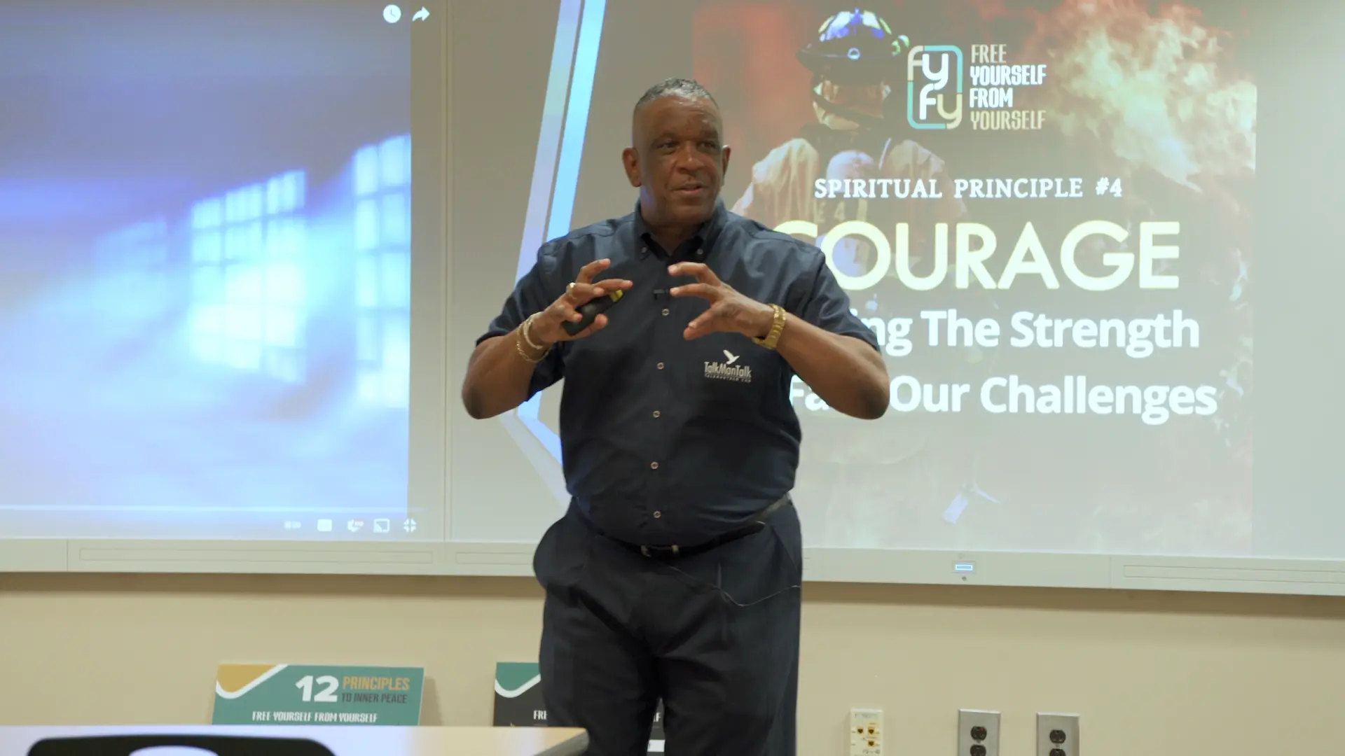 Timothy Stewart speaking in front of a slide about courage